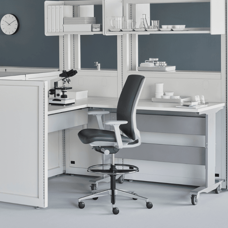 Ergonomic black and white Verus Stool by Herman Miller for labs and drafting spaces.