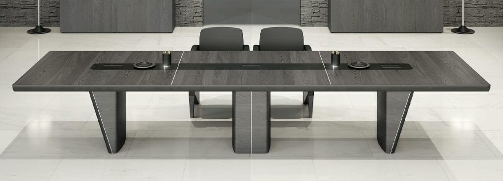iSixty executive desk. Gray wood conference table with power outlets and modern design.