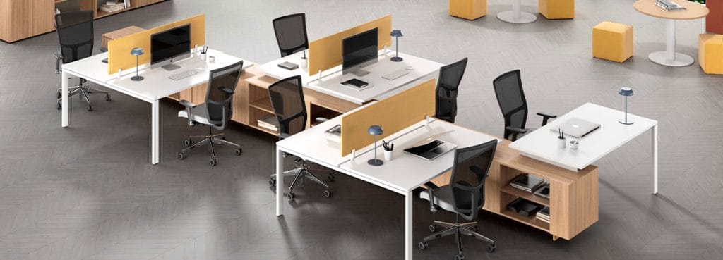 Modern Legodesk office furniture with white tops, wood accents, and yellow dividers.