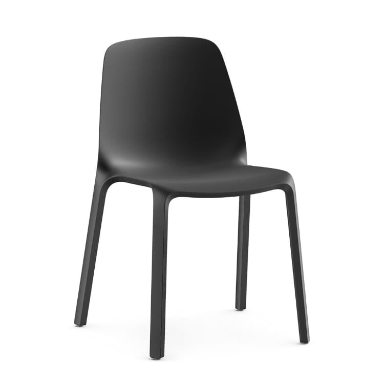 Modern black MONOis1 chair. Sleek design, perfect for meeting spaces and seminars. Stackable, space-saving seating.