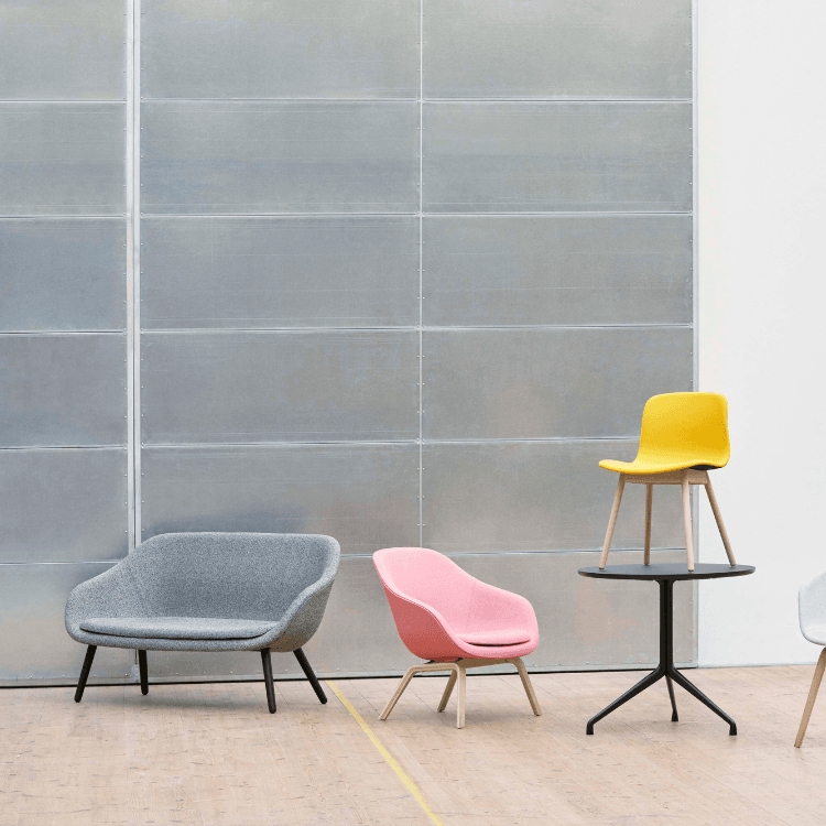 HAY AAL Sofa collection. Minimalist design in gray, pink, and yellow. Social & relaxed seating.