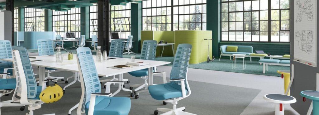 Open office featuring PUREis3 task chairs in blue and white, promoting dynamic, healthy sitting.