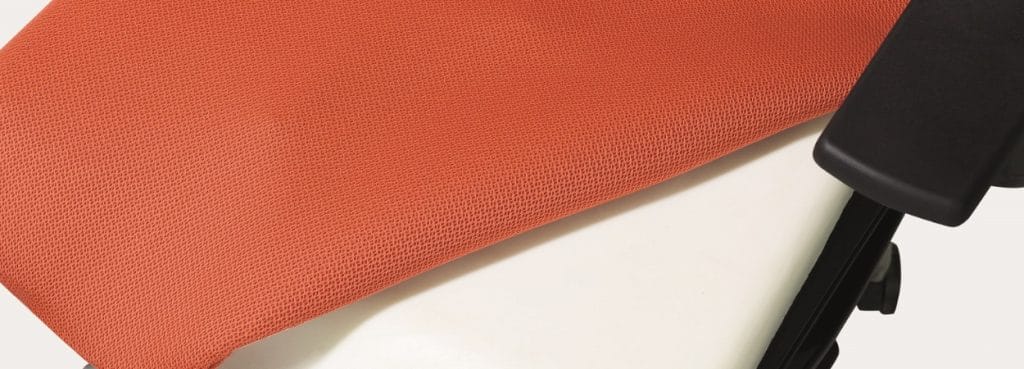 Close-up of the orange Solar ergonomic task chair.