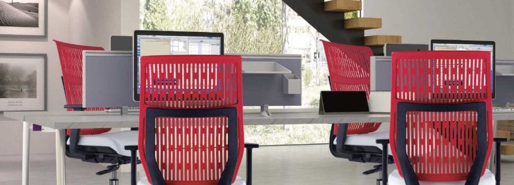 Modern office space with Leap ergonomic task chairs in red. Customizable comfort for open spaces and studio offices.