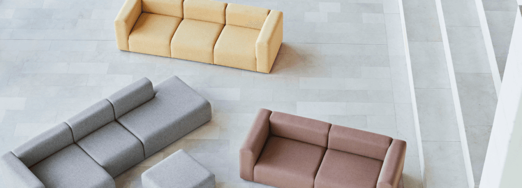 Overhead shot of HAY Mags Sofa in yellow, gray, and brown. Modular seating for social and relaxed spaces.