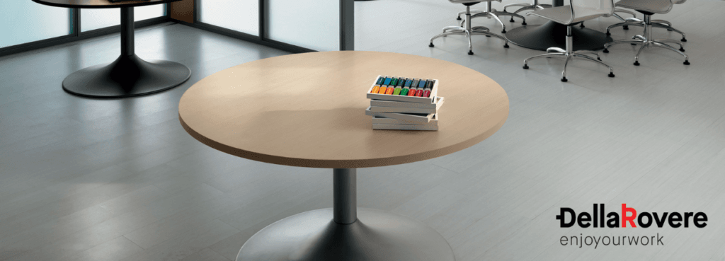 Minimalist UNI Meeting Table. Round, light wood top with a sleek, metal base. Perfect for modern office spaces.