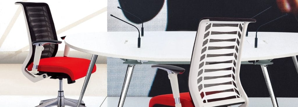 Modern Scope ergonomic office chair with red seat and mesh back.