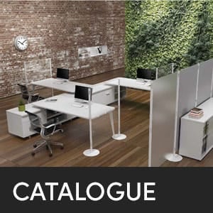 Office furniture catalogue: Modern office space with desks, chairs, and dividers against a brick and green wall.