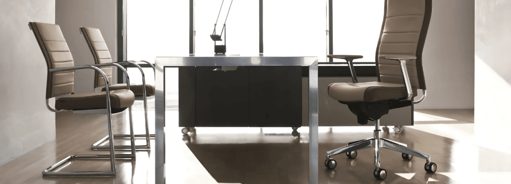 Kosmo Top executive chair in beige leather with polished aluminum frame, adjustable lumbar support, and ergonomic design.