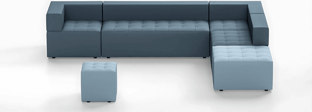 Modern blue Kuadra modular sofa with ottoman. Customizable seating for social spaces.