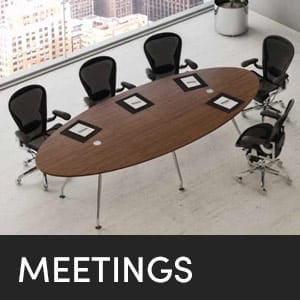 Conference room with an oval table and six chairs for meetings.
