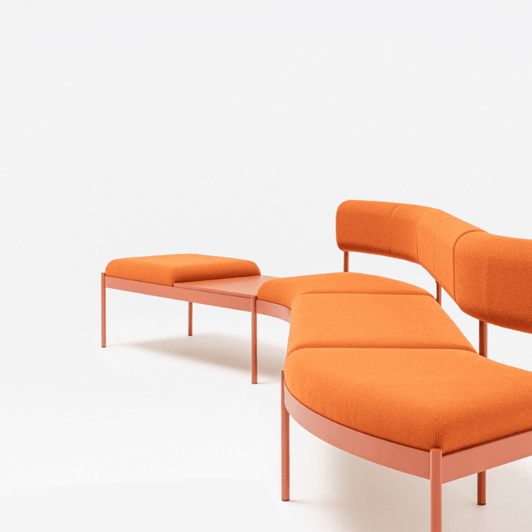 Modern orange Nora modular seating system by MDD for welcome areas and public spaces.