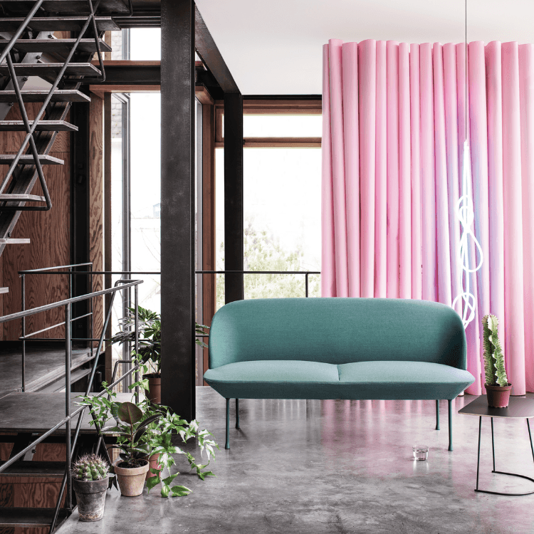Modern teal Oslo Sofa with slender legs. Scandinavian design for social and relaxed spaces.