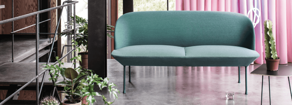Modern Oslo Sofa in teal. Sleek Scandinavian design with smooth curves and slender legs. Perfect for modern homes.