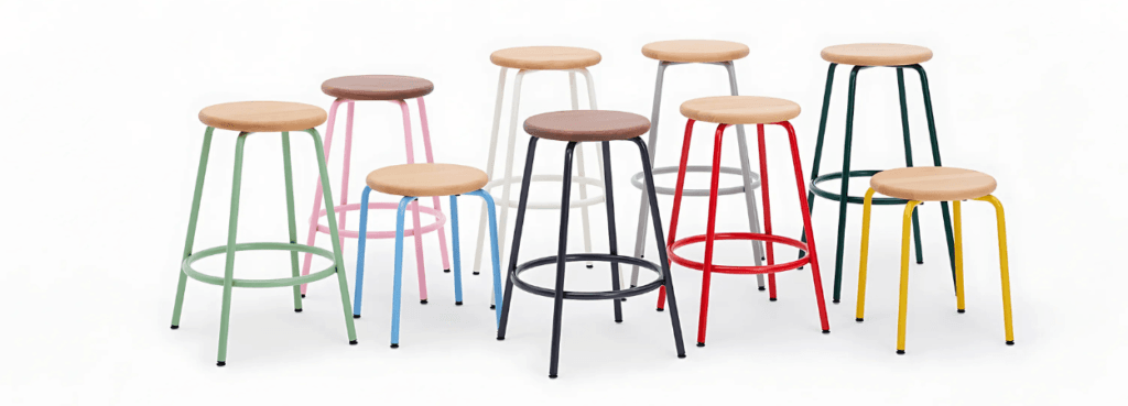 Colorful Penny Stool collection by NaughtOne. Oak or walnut seat with customizable leg colors. Perfect seating option.