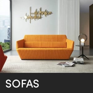 Orange SOFAS in a modern living room with a unique wall decor and side table.