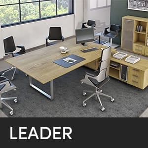 Studio office featuring the LEADER desk, chairs, and storage. Modern office furniture.
