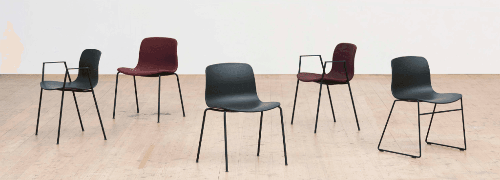 Modern AAC 08 chairs by HAY. Steel frame, recycled shell in black and burgundy.
