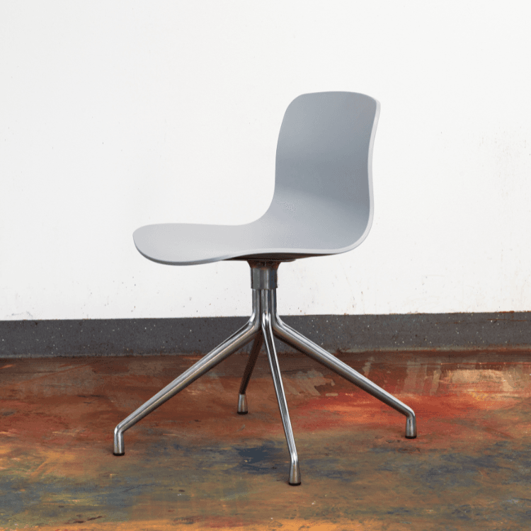 HAY AAC 10 chair. Gray recycled plastic shell, swivel, and cast aluminum base. Modern office seating.