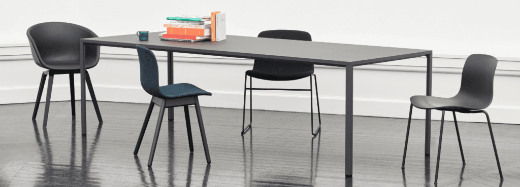 Modern office: AAC 13 chairs around a table. Sleek design, ideal for reception areas.