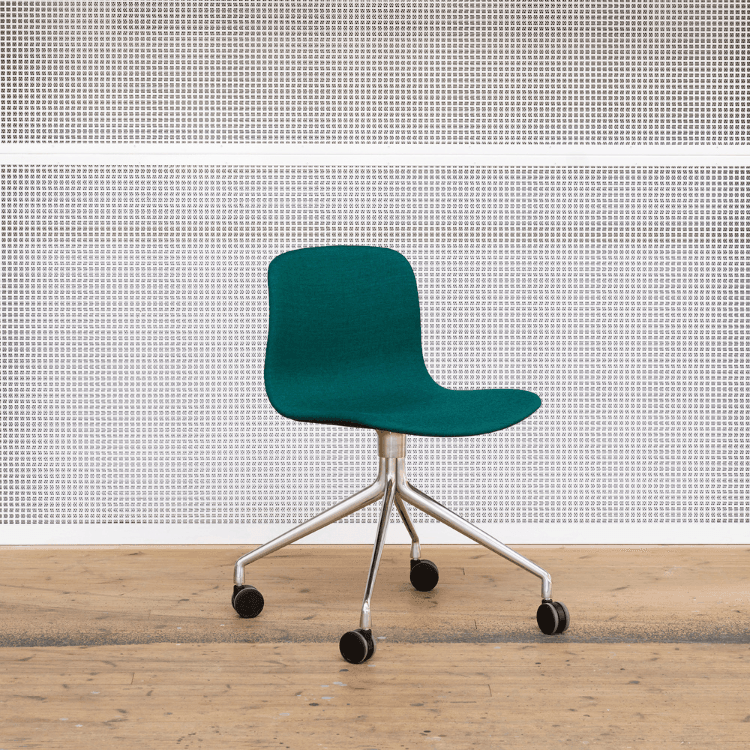 HAY AAC 15 swivel chair. Teal fabric seat with a polished aluminum base and black castor wheels.