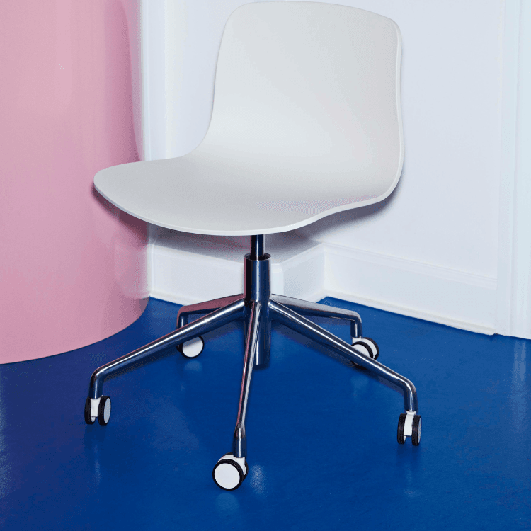 White AAC 50 task chair with a chrome base and castor wheels.