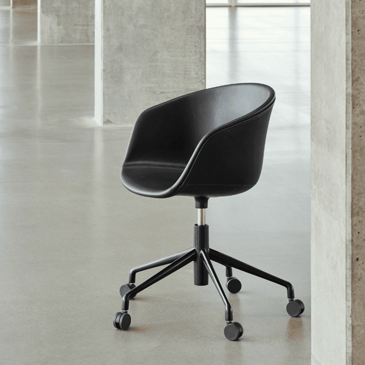 HAY AAC 53 executive chair in black leather with a five-legged castor base.