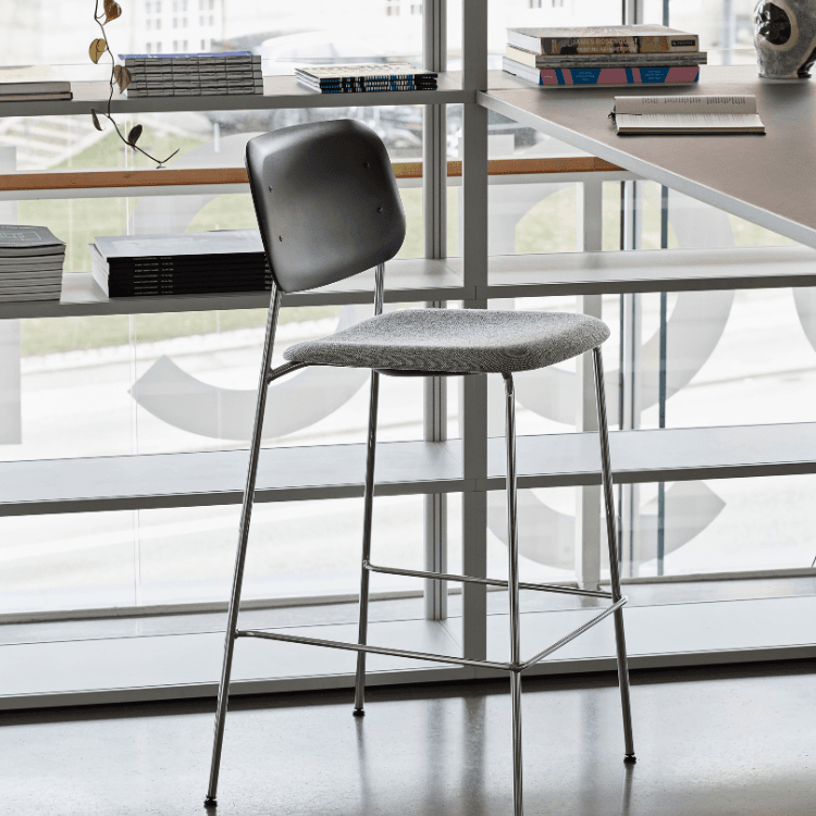 HAY Soft Edge 95 bar stool. Gray plastic seat/back, steel legs. Minimalist design.