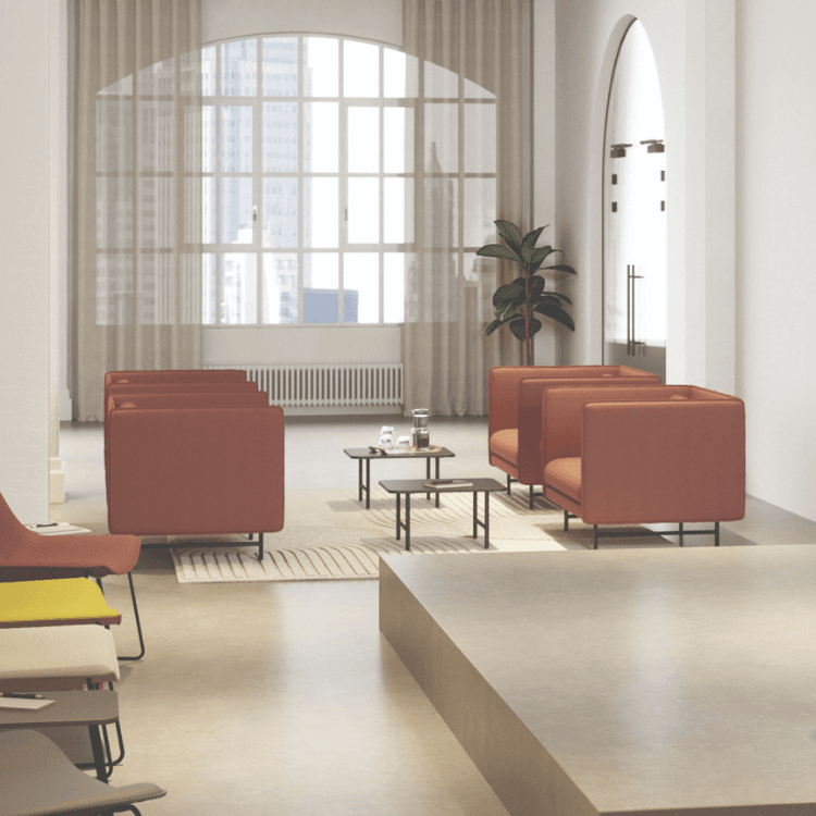 Modern office space featuring Interstuhl's QOMFORTis1 Sofa. Modular seating in terracotta color, promoting collaboration.