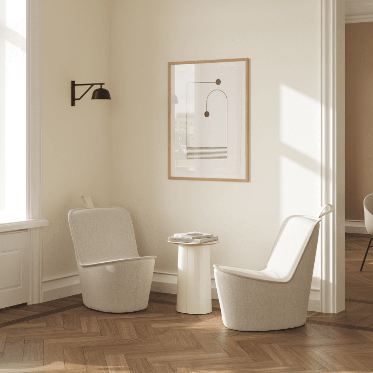 Two Pippin Chairs in a bright, modern space. Neutral tones, minimalist design. NaughtOne seating.