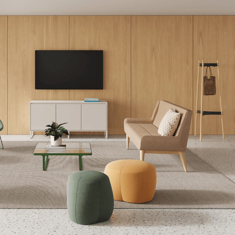 Modern living space featuring a green and yellow Truffle Pouf, offering comfort and style for agile workspaces.