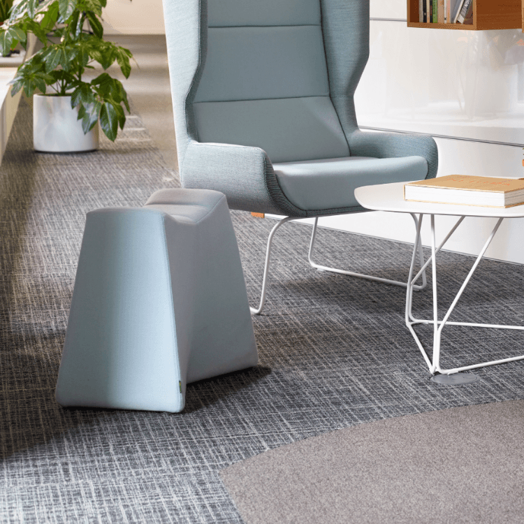 Modern light blue Pinch Stool. Versatile seating for open spaces.