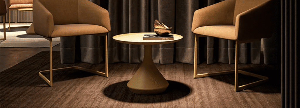 Modern Lamp Table in gold. Round accent table with book and bowl. Contemporary furniture.