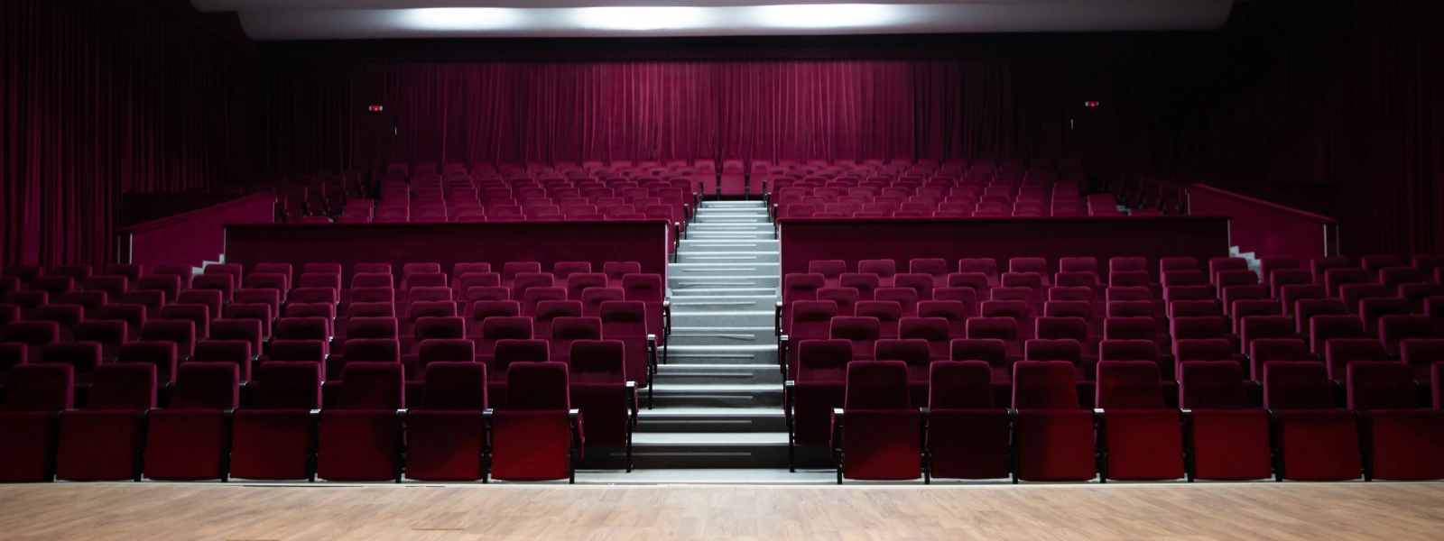 Empty amphitheater with red velvet seats and curtains, Cyprus furniture.