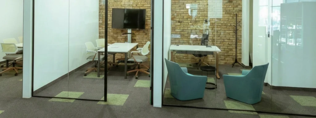 Meeting booth in Cyprus, smart office solution with glass walls, table, chairs, monitor for focused workspaces. Meeting-booth.webp