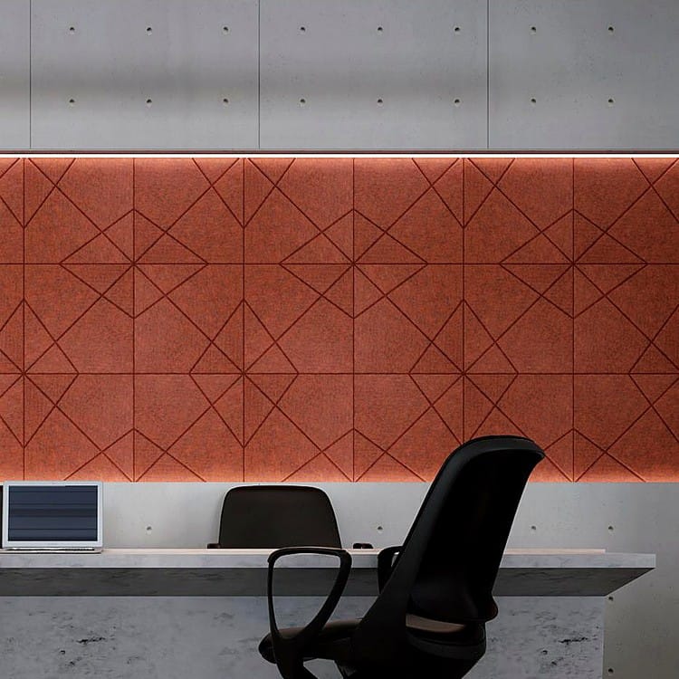 Terracotta X Form felt panels featuring a deep embossed diamond pattern, creating a textured feature wall in an office.