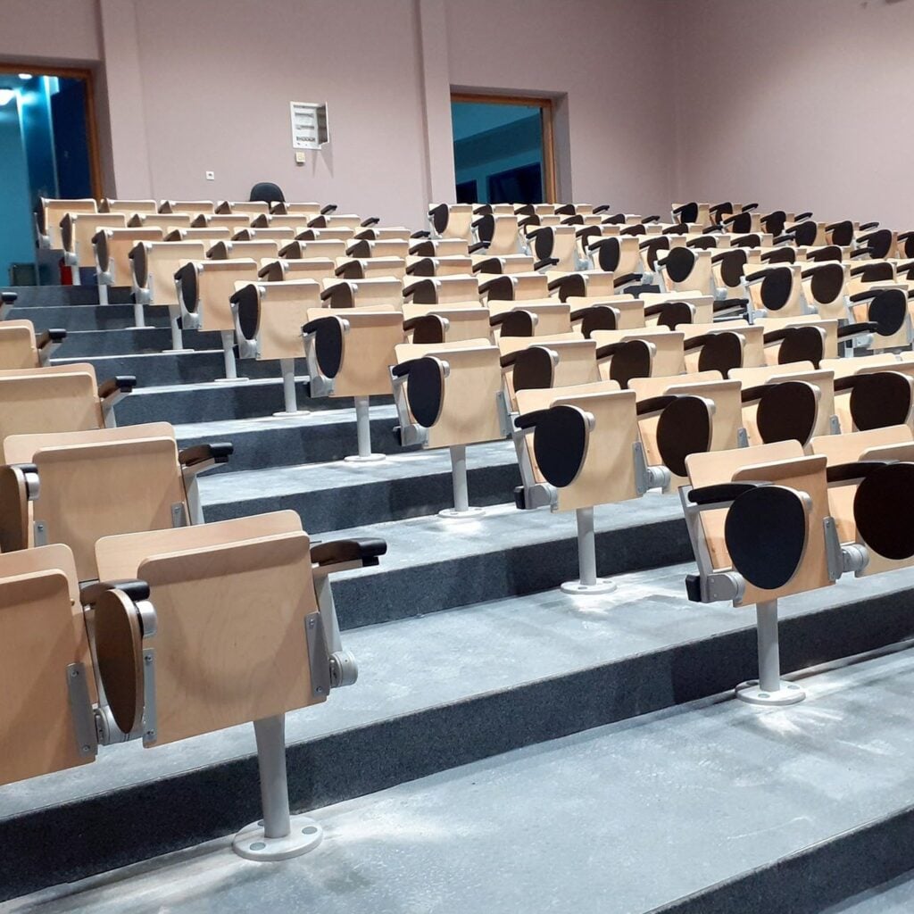Aegean seats with writing tablets in a lecture hall