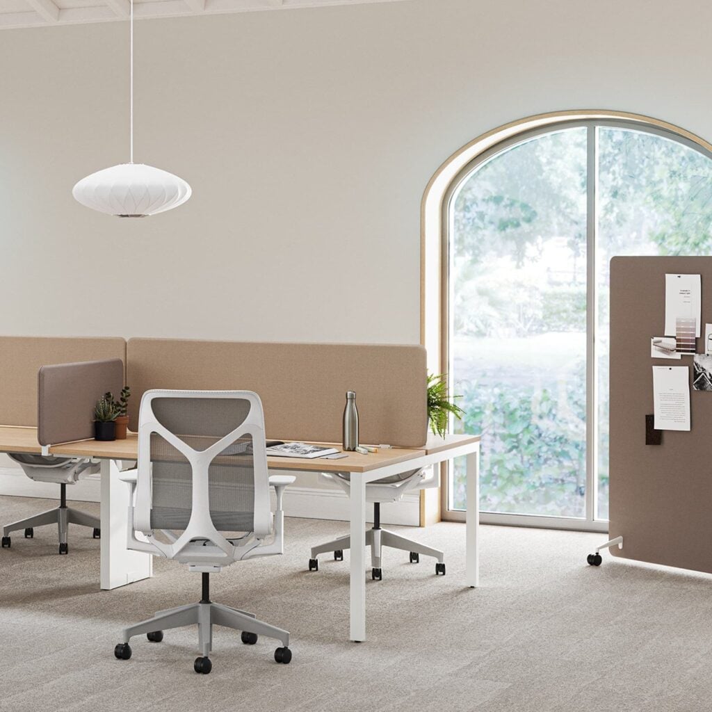 Bound mobile screen beside desks in an open office