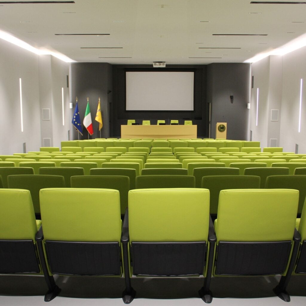 Green Eidos seats in a conference auditorium