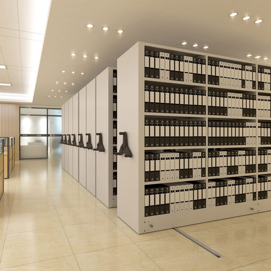 Mobile archive shelving with handwheels in an office archive