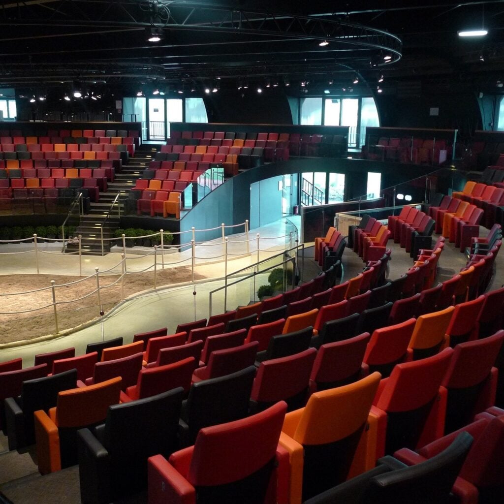 Curved rows of red Tempo seats