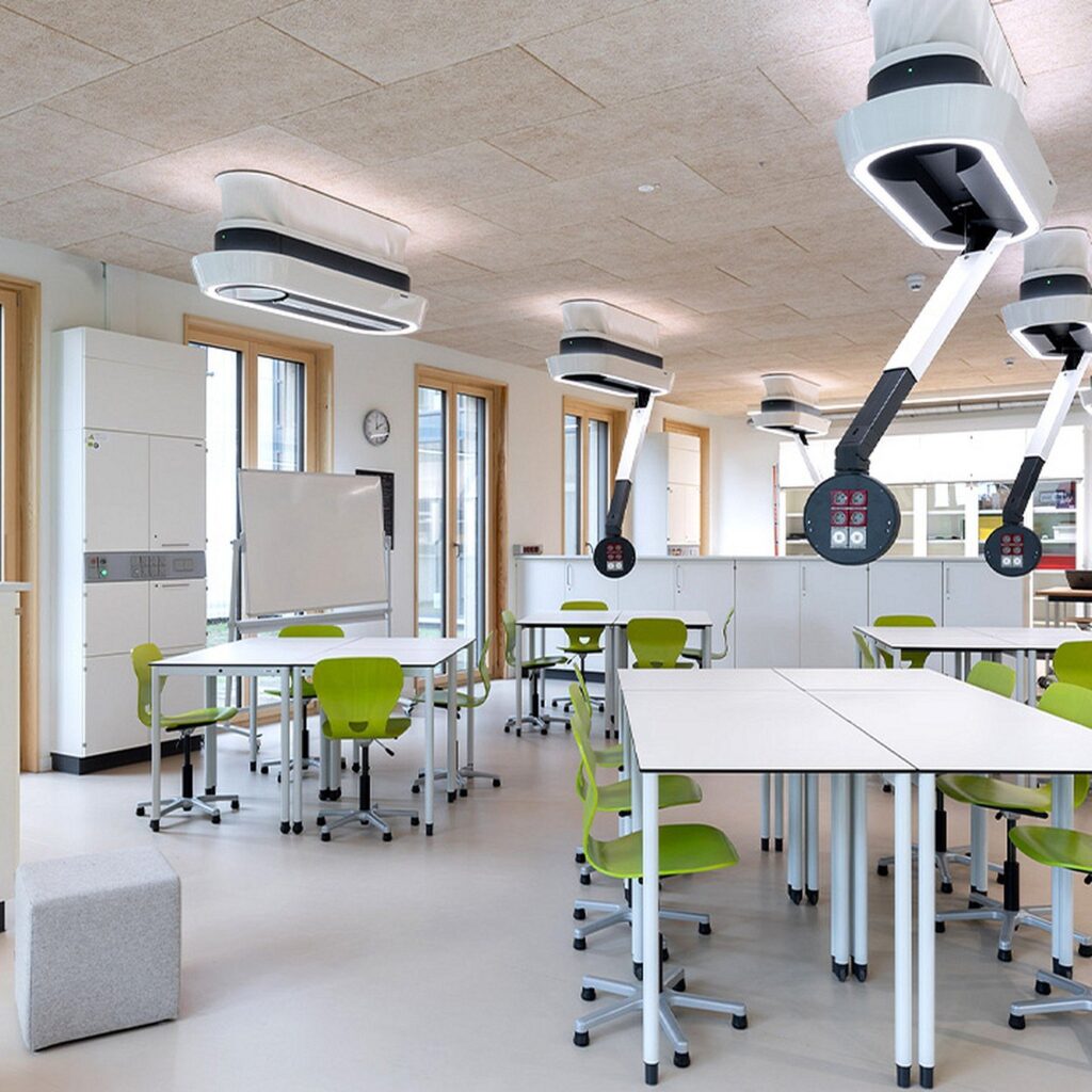 Science room with ceiling media arms and mobile tables